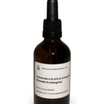 Amber glass bottle containing a Dutasteride and Minoxidil solution with black bulb graduated pipette