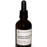 Amber glass bottle containing a Dutasteride and Minoxidil solution with black bulb graduated pipette