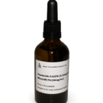 Amber glass bottle containing a Finasteride and Minoxidil solution with black bulb graduated pipette