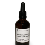 Amber glass bottle containing a Minoxidil and Tretinoin solution with black bulb graduated pipette