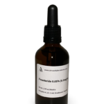 Amber glass bottle containing a Finasteride and Finasteride solution with black bulb graduated pipette