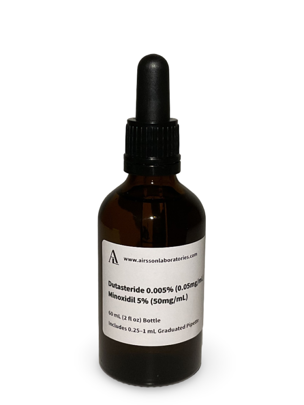Amber glass bottle containing a Dutasteride and Minoxidil solution with black bulb graduated pipette